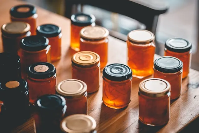 Golden honey jars on a wooden table – nature’s best natural healer